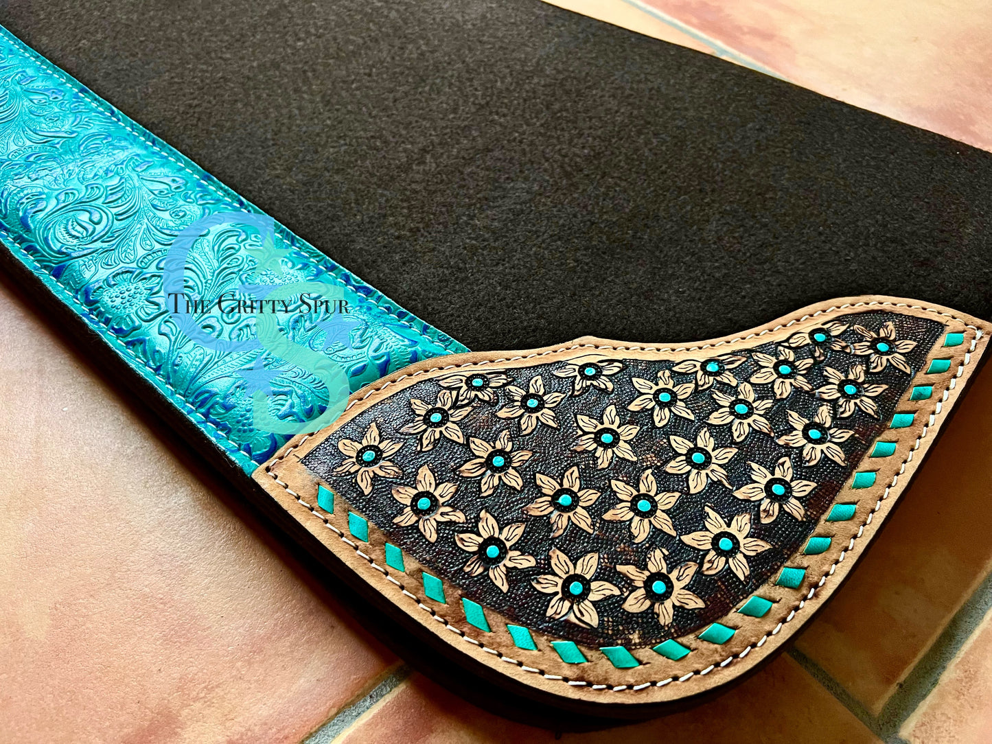 32" x 31" felt teal accented saddle pad with flower tooling