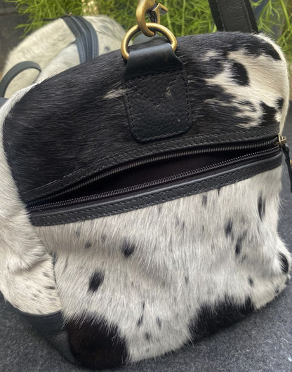 Black and white cowhide duffle bag